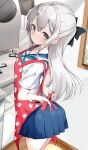  1girl absurdres apron arms_behind_back blue_skirt bow from_behind grey_eyes hair_bow hamaken._(novelize) highres indoors kitchen long_hair looking_back original red_apron ribbon school_uniform serafuku shirt short_sleeves silver_hair skirt solo tying tying_apron white_shirt 