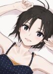  1girl antenna_hair armpits bangs bare_shoulders black_camisole black_eyes black_hair camisole close-up commentary drop_shadow dutch_angle hair_between_eyes hands_up highres idolmaster idolmaster_(classic) idolmaster_2 idolmaster_million_live! idolmaster_million_live!_theater_days kikuchi_makoto light_blush looking_at_viewer lying mogskg on_back orange_camisole parted_lips polka_dot polka_dot_camisole short_hair smile solo undershirt 
