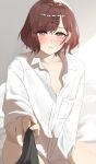  0923_azu 1girl :o blush brown_hair collarbone highres higuchi_madoka holding holding_clothes idolmaster idolmaster_shiny_colors looking_at_viewer mole mole_under_eye open_collar oversized_clothes oversized_shirt pov red_eyes shirt short_hair solo white_shirt 