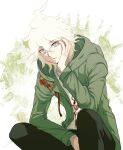  1boy bangs brown_background brown_pants danganronpa_(series) danganronpa_2:_goodbye_despair dosugon eyebrows_visible_through_hair green_jacket head_rest hood hood_down jacket komaeda_nagito long_sleeves male_focus medium_hair open_clothes open_jacket pants print_shirt shirt white_background white_shirt 