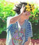  1boy adjusting_eyewear bee_print brown_hair bush dappled_sunlight facepaint glasses hand_on_eyewear highres looking_over_eyewear looking_to_the_side male_focus messy_hair original outdoors print_shirt shirt short_hair smile solo sunlight weilin_zhang 