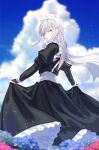  1girl bangs blurry blurry_foreground cross cross_earrings day earrings from_behind highres jewelry kfr long_hair long_sleeves looking_at_viewer maid maid_headdress original outdoors puffy_long_sleeves puffy_sleeves solo swept_bangs white_hair wind yellow_eyes 