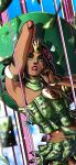  1girl absurdres arm_up armlet armpits artist_name banknote black_hair bracelet brooch camouflage commentary dark-skinned_female dark_skin dragona_joestar english_commentary flower_wreath green_eyes green_skirt head_wreath highres jewelry jojo_no_kimyou_na_bouken long_hair looking_at_viewer makeup midriff money money_costume navel noonvincent parted_lips red_lips skirt solo strapless teeth the_jojolands 