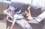  1girl ahoge barefoot black_horns black_shorts braid closed_eyes couch curtains dakimakura_(object) hana_mori hololive horns indoors la+_darknesss long_hair lying multicolored_hair on_couch on_stomach pillow purple_eyes shirt shorts soles solo streaked_hair striped_horns t-shirt tokoyami_towa virtual_youtuber white_shirt window 