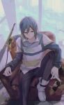  1boy absurdres alternate_costume beileimao black_pants blue_eyes blue_hair couch from_above gun highres holding kaito_(vocaloid) knee_up male_focus muted_color pants scarf sitting solo vocaloid weapon 