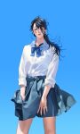  1girl asae_(1313604a) bangs black_hair blue_background blue_bow blue_bowtie blue_eyes blue_skirt bow bowtie collared_shirt cowboy_shot dress_shirt fingernails frown hair_over_one_eye highres lips long_hair long_sleeves looking_down miniskirt one_eye_covered original school_uniform shirt skirt sleeves_folded_up solo white_shirt wind 