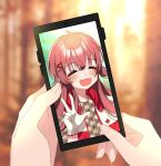  1girl 1other :d =_= ahoge blurry blurry_background blush cellphone cellphone_picture depth_of_field gloves hand_focus highres idol idolmaster idolmaster_shiny_colors komiya_kaho phone phone_screen red_hair shiny shiny_hair smile sunyack upper_body w white_gloves 