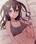  1girl bangs bed_sheet breasts brown_eyes brown_hair clothes_lift collarbone grey_sports_bra hair_between_eyes highres idolmaster idolmaster_cinderella_girls lifted_by_self long_hair looking_at_viewer lying mariabowl medium_breasts midriff mole mole_under_eye navel on_back sharp_teeth smile solo sports_bra sports_bra_lift sunazuka_akira teeth two_side_up underboob 