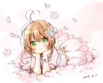  1girl absurdres ahoge bangs blush brown_hair cardcaptor_sakura cherry_blossoms dated eyebrows_visible_through_hair flower green_eyes hair_flower hair_ornament hands_on_own_chin highres kinomoto_sakura looking_at_viewer lying on_stomach puffy_short_sleeves puffy_sleeves short_hair short_sleeves simple_background sketch smile solo solo_focus uchino_maiko 
