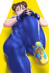  1girl anagumasan blue_bodysuit bodysuit brown_eyes brown_hair chun-li covered_abs cross-laced_footwear double_bun exercise fingerless_gloves gloves hair_ribbon highres lying muscular muscular_female on_back ribbon skin_tight solo street_fighter yellow_ribbon 