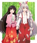  2girls :d bamboo bamboo_forest black_hair border bow closed_eyes collared_shirt eyebrows_visible_through_hair forest frilled_sleeves frills fujiwara_no_mokou green_bow grey_hair hair_bow hand_in_own_hair highres holding_hands houraisan_kaguya long_hair long_sleeves looking_to_the_side multiple_bows multiple_girls nature ofuda ofuda_on_clothes oni_tama open_mouth outdoors pants pink_shirt red_eyes red_pants red_skirt shirt skirt smile standing suspenders touhou white_border white_bow white_shirt wide_sleeves 