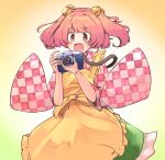  1girl apron bell blush camera checkered checkered_clothes checkered_kimono checkered_shirt cowboy_shot eyebrows_visible_through_hair ginnkei hair_bell hair_ornament highres holding holding_camera japanese_clothes kimono motoori_kosuzu open_mouth shirt short_hair smile solo touhou two_side_up unmoving_pattern wide_sleeves 
