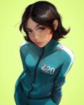  1girl arms_behind_back black_hair blood blood_on_clothes blood_splatter freckles green_background green_jacket highres jacket ji_yeong long_sleeves looking_at_viewer pants ross_tran short_hair simple_background solo squid_game track_jacket track_pants track_suit 