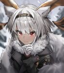  1girl animal_ears arknights bangs black_coat blurry blurry_background carnelian_(arknights) carnelian_(hohenlohe_chillysand)_(arknights) closed_mouth coat collarbone dark-skinned_female dark_skin depth_of_field eyebrows_visible_through_hair fur_collar gloves goat_ears goat_girl goat_horns hand_on_own_cheek hand_on_own_face highres horns long_sleeves looking_at_viewer official_alternate_costume outdoors raw_egg_lent red_eyes short_hair silver_hair smile snowing solo upper_body white_gloves 
