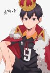  1610aoi 1boy black_eyes black_hair black_shorts cape crown elbow_on_knee fur_trim haikyuu!! highres kageyama_tobio looking_at_viewer male_focus red_cape shorts simple_background sitting solo white_background 