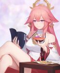  1girl absurdres alcohol animal_ears bare_shoulders book breasts closed_mouth crossed_legs cup detached_sleeves food fox_ears genshin_impact hair_between_eyes hair_ornament highres holding holding_book legs long_sleeves pink_hair purple_eyes reading sakazuki sake sitting smile solo table yae_miko yidie 