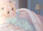  1girl animal_ears bed bedroom blonde_hair blue_dress blue_nightgown brown_eyes dress horns indoors lamp lifting_covers looking_at_viewer lying nightgown on_side open_mouth original pillow sakumofu_(sak2mof2) sheep_ears sheep_girl sheep_horns short_hair short_sleeves sleepwear slit_pupils smile solo under_covers 
