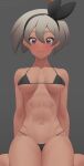  1girl abs arm_support arms_behind_back bangs bare_arms bea_(pokemon) bikini black_bikini black_hairband blush bow_hairband breasts closed_mouth commentary_request embarrassed eyelashes grey_background grey_eyes hair_between_eyes hairband looking_at_viewer muscular muscular_female navel pokemon pokemon_(game) pokemon_swsh putcher simple_background sitting solo swimsuit watermark web_address 