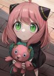  1girl absurdres ahoge anya_(spy_x_family) black_dress child doll double_bun dress green_eyes highres holding holding_doll horns long_sleeves myuga66666 pink_hair short_hair solo spy_x_family standing stuffed_animal stuffed_toy wooden_floor 