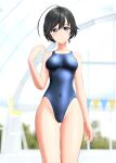  1girl absurdres ahoge black_eyes black_hair blue_swimsuit blurry blurry_background breasts commentary_request competition_swimsuit covered_navel cowboy_shot girls_und_panzer highres indoors isuzu_hana long_hair medium_breasts one-piece_swimsuit solo string_of_flags swimsuit takafumi thigh_gap updo 