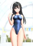  1girl absurdres ahoge black_eyes black_hair blue_swimsuit blurry blurry_background breasts commentary_request competition_swimsuit covered_navel cowboy_shot girls_und_panzer highres indoors isuzu_hana long_hair medium_breasts one-piece_swimsuit solo string_of_flags swimsuit takafumi thigh_gap 