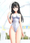  1girl absurdres ahoge black_eyes black_hair blurry blurry_background breasts commentary_request competition_swimsuit covered_navel cowboy_shot girls_und_panzer highres indoors isuzu_hana long_hair medium_breasts one-piece_swimsuit solo string_of_flags swimsuit takafumi thigh_gap white_swimsuit 