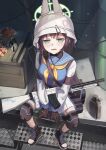  annoyed barrel black_hair blue_archive blue_eyes blush boots breasts canteen commentary_request crate food gloves gun halo helmet highres knee_pads light_machine_gun looking_at_viewer medium_breasts saki_(blue_archive) school_uniform serafuku short_hair sitting tactical_clothes weapon yanoyoru 