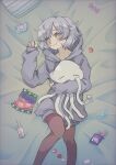  1girl blush candy candy_wrapper doll_hug food grey_hair grey_hoodie highres hood hoodie konpeitou lollipop looking_to_the_side lying mashi_fish29_(artist) miwa_mitsune object_hug on_back on_bed orange_eyes pantyhose smile solo squid stuffed_animal stuffed_toy 