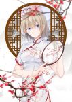  1girl blonde_hair blurry blurry_foreground branch breasts china_dress chinese_clothes diao_mao_de_yu_shushu dress eyebrows_behind_hair flower hair_behind_ear hand_fan head_tilt highres holding holding_fan looking_at_viewer medium_breasts olivia_(otome_gee_sekai_wa_mob_ni_kibishii_sekai_desu) otome_gee_sekai_wa_mob_ni_kibishii_sekai_desu parted_lips red_flower smile solo white_dress 