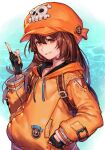  1girl anchor_symbol backpack bag black_gloves brown_hair closed_mouth fingerless_gloves gloves guilty_gear guilty_gear_strive hair_between_eyes hat hood hoodie hungry_clicker index_finger_raised long_hair long_sleeves looking_at_viewer may_(guilty_gear) ocean orange_eyes orange_headwear orange_hoodie pointing pointing_up skull_and_crossbones smile solo 
