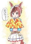  1girl :d animal_ears bangs belt brown_eyes brown_hair commentary cowboy_shot highres horse_ears horse_girl horse_tail light_blush looking_at_viewer multicolored_hair navel nice_nature_(umamusume) open_mouth panzuban pom_pom_(cheerleading) ponytail simple_background skirt smile solo speech_bubble streaked_hair tail translation_request twitter_username two-tone_hair umamusume yellow_background 